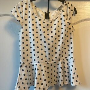 Black and white polka dot peplum top with zipper down the back